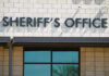 Mass Grave Discovered at ‘No-Kill’ Animal Sanctuary Sheriffs Office sign on brick building faade.