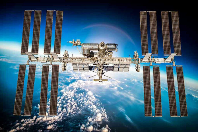 311480090 International Space Station orbiting above Earth.