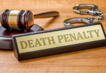 Four Convicted during Nigeria Church Attack Gavel, handcuffs, and Death Penalty sign on desk.