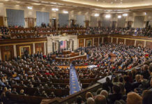 Lawmakers Advance Long-Term Israel Defense Support Large assembly in a government legislative chamber.