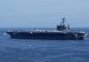 U.S. Helicopter Loss Near Hormuz Ignites Crisis A large aircraft carrier sailing in the ocean