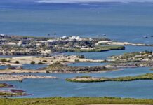Kharg Island Exposes Ground War Limits Aerial view of a coastal landscape featuring waterways and islands