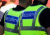World Cup Panic: FBI On Max Alert Two security personnel wearing high visibility vests with SECURITY printed on the back