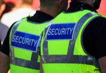 World Cup Panic: FBI On Max Alert Two security personnel wearing high visibility vests with SECURITY printed on the back