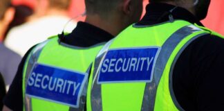 World Cup Panic: FBI On Max Alert Two security personnel wearing high visibility vests with SECURITY printed on the back