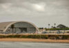 No Flight Logs. No Witnesses. Just a Viral Rumor. Aircraft hangar with helicopters near the beach.
