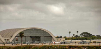 No Flight Logs. No Witnesses. Just a Viral Rumor. Aircraft hangar with helicopters near the beach.