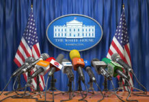 Congress Quietly Builds Israel War Pipeline Multiple microphones at White House press briefing podium.