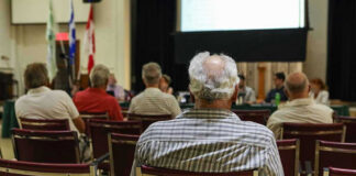 People attending a meeting in a conference room.