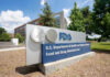 FDA Greenlights ZYN, Handing Big Tobacco a Major Win FDA building sign with blue sky background.