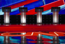 America’s Future May Depend on Getting Patriotism Right Four debate podiums on a CNN stage background.