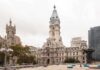 Clockfight Explodes In Congress Philadelphia City Hall with a cloudy sky in the background