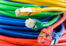 Quantum Bomb Ticks Under The Internet Colorful network cables with various connectors arranged in a pile