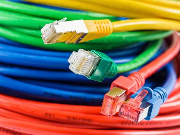 shutterstock_155793599-1 Colorful network cables with various connectors arranged in a pile