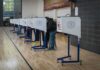 The Supreme Court Just Delivered Another Twist in the Battle Voters at polling booths in a gymnasium