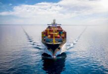 Radio Threats Freeze Saudi Oil Lifeline Container ship sailing on calm ocean