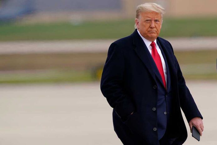 shutterstock_1876973395-1 Donald Trump walking outdoors in formal attire
