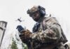 Millions of Drones, One New Strategy soldier operating a drone with a handheld controller