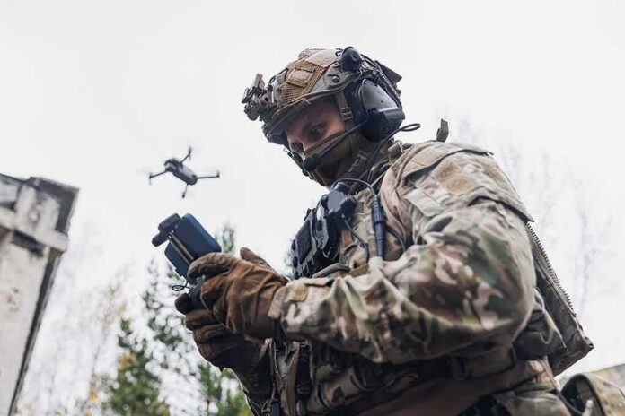 shutterstock_2249726127 soldier operating a drone with a handheld controller
