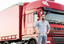 Veterans Could Be the Answer to America’s Truck Driver Shortage man standing in front of a red semi truck