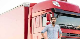 man standing in front of a red semi truck