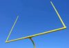 The Messi Record Everyone’s Arguing About Yellow football goalpost against a clear blue sky