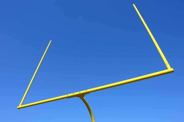 shutterstock_60489847 Yellow football goalpost against a clear blue sky