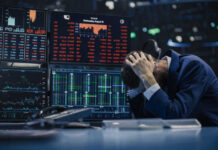 White House Speech Access Leads to Betting Penalty Trader stressed out by multiple declining stock charts.