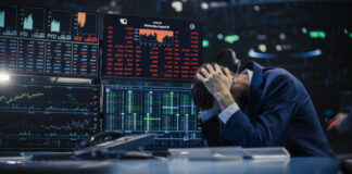White House Speech Access Leads to Betting Penalty Trader stressed out by multiple declining stock charts.