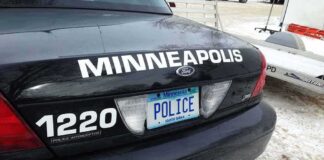 Rear of Minneapolis police car with Minnesota license plate