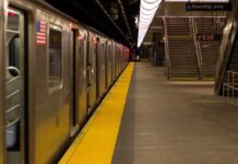 Subway train at an empty underground platform