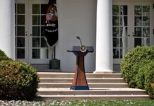 Leak Scandal Hits Secret Service as 3 Officials Go on Leave Podium with presidential seal in a garden colonnade