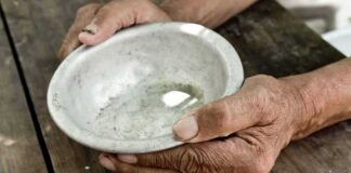 hands holding an empty bowl