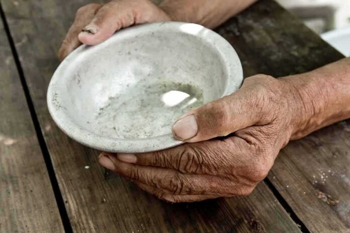 hands holding an empty bowl