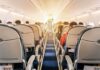 Mysterious Odor Forces Frontier Flight to Divert airplane cabin with passengers seated in economy class
