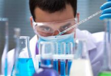 Animals Found to Digest Nature’s Original Bioplastic Scientist pipetting blue liquid into test tubes