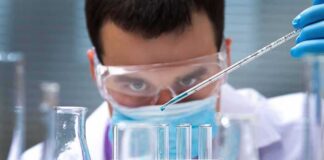 Animals Found to Digest Nature’s Original Bioplastic Scientist pipetting blue liquid into test tubes