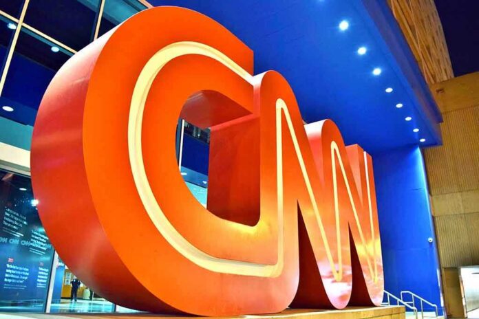 shutterstock_1399539086 Large red CNN logo sculpture at building entrance