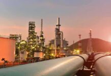 World Loses 2.6 Billion Barrels in Worst Oil Shock Since 1979 Oil refinery with pipelines at sunset