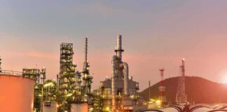 World Loses 2.6 Billion Barrels in Worst Oil Shock Since 1979 Oil refinery with pipelines at sunset
