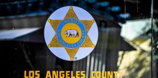 Los Angeles County Sheriff emblem on a glass door