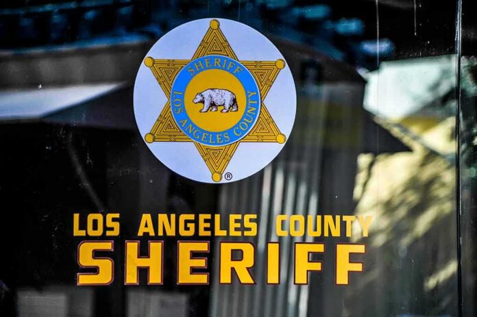 shutterstock_1663178266 Los Angeles County Sheriff emblem on a glass door