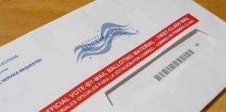 Late Ballots Crush Spencer Pratt’s Runoff Hopes Mail-in ballot envelope with red label on wooden table