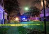 Police Find Toddler Alone as Drug Investigation Police car blocks residential street at night behind caution tape
