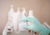 Gloved hand holding a syringe