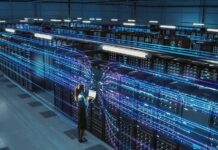 Meta Tests Robots for Data Center Operations Technician with laptop in a large data center aisle