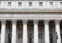 Founder Reported Epstein to FBI, Lawsuit Claims United States courthouse facade with Corinthian columns
