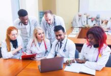 Industrial Meth Lab Discovered in Nigeria Medical students gathered around a laptop in a classroom