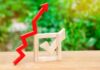 $6.20 Gas Puts Trump’s Energy Record Under Scrutiny Red upward arrow and wooden check mark on a table