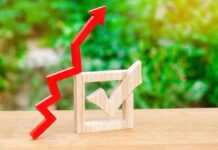 $6.20 Gas Puts Trump’s Energy Record Under Scrutiny Red upward arrow and wooden check mark on a table